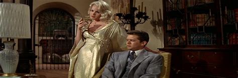 Carroll Baker Goes Nude in “The Carpetbaggers”